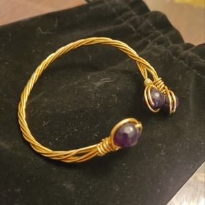 Cuff bracelet with dark purple crystal stones